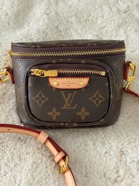 Compact Dark Brown Leather Crossbody Bag with Gold Hardware
